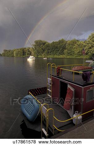 rainbow, Erie Canal, Upstate, New York, Rainbow over the Erie Canal after a thunderstorm in Sylvan Beach in the state of New York. View Large Photo Image Stock Photo - rainbow, Erie Canal, Upstate, New York, Rainbow over the Erie Canal after a thunderstorm in Sylvan Beach in the state of New York.. Fotosearch