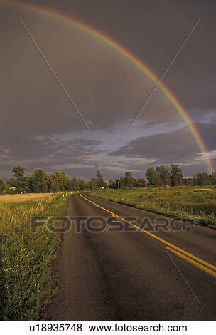 rainbow, Upstate, New York, Rainbow over country road after a rain storm in Oneida County in the state of New York. View Large Photo Image Stock Photo - rainbow, Upstate, New York, Rainbow over country road after a rain storm in Oneida County in the state of New York.. Fotosearch