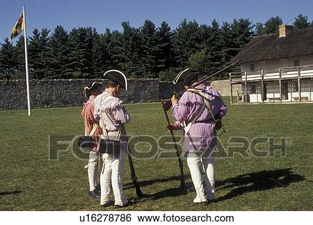 Stock Photograph -  reenactment, fort, Fort Frederick, Maryland, 1776 Frontier Fort, Men in Continental Army authentic clothing at the reenactment of the American Revolution at Fort Frederick State Park in Big Pool in the state of Maryland. . Fotosearch