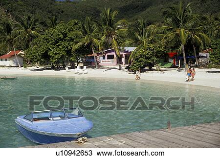 resort, British Virgin Islands, Jost Van Dyke, Caribbean, Virgin Islands, BVI, B. V. I Scenic coastline and boat moored on dock of Great Harbor on the island of Jost Van Dyke on the British Virgin Islands. View Large Photo Image Stock Image - resort, British Virgin Islands, Jost Van Dyke, Caribbean, Virgin Islands, BVI, B. V. I Scenic coastline and boat moored on dock of Great Harbor on the island of Jost Van Dyke on the British Virgin Islands.. Fotosearch