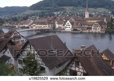 Stock Photo -  Rhine River, Switzerland, Stein, Europe, Scenic view of the picturesque village of Stein am Rhein with its half-timbered houses along the Rhine River in the Canton of Schaffhausen.. Fotosearch