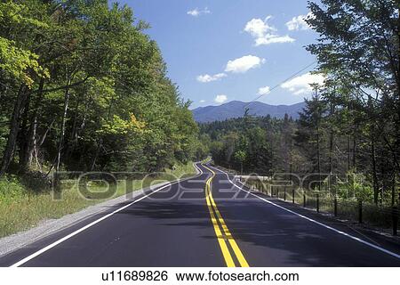 road, Adirondacks, Adirondack Park, New York, Mountain road in Lake Placid in the state of New York. View Large Photo Image Stock Photograph - road, Adirondacks, Adirondack Park, New York, Mountain road in Lake Placid in the state of New York. . Fotosearch