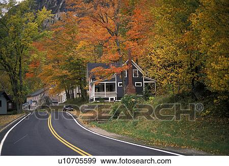 Stock Photo -  road, fall, Vermont, A winding road passes through [cottages, houses] along Lake Willoughby in Westmore.. Fotosearch