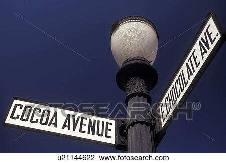 road signs, Hershey, chocolate, Pennsylvania, East Chocolate Avenue and Cocoa Avenue street signs on a black post against a blue sky in downtown Hershey in the state of Pennsylvania. View Large Photo Image Stock Image - road signs, Hershey, chocolate, Pennsylvania, East Chocolate Avenue and Cocoa Avenue street signs on a black post against a blue sky in downtown Hershey in the state of Pennsylvania. . Fotosearch