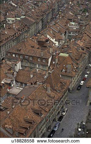 Stock Photo -  rooftops, Bern, Switzerland, Europe, Scenic aerial view of the tile rooftops of the Old Town of the capital city of Bern and its narrow streets from the cathedral in the canton of Bern.. Fotosearch