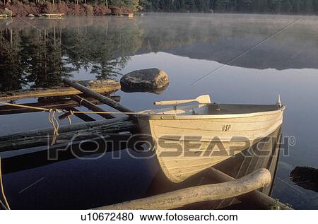 rowboat, lake, reflection, Maine, Baxter State Park, A rowboat is docked on the calm waters of Daicey Pond in the early morning in Baxter State Park. View Large Photo Image Stock Image - rowboat, lake, reflection, Maine, Baxter State Park, A rowboat is docked on the calm waters of Daicey Pond in the early morning in Baxter State Park. . Fotosearch