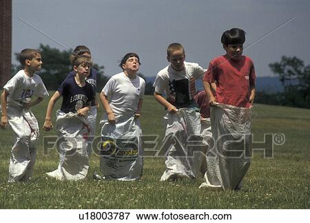 sack race, relay race, sport, race, Pennsylvania, Elementary school boys competing in a potato sack race at Lionville Elementary School in Lionville in the state of Pennsylvania. View Large Photo Image Stock Photo - sack race, relay race, sport, race, Pennsylvania, Elementary school boys competing in a potato sack race at Lionville Elementary School in Lionville in the state of Pennsylvania. . Fotosearch