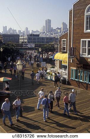 San Francisco, Fisherman's Wharf, Bay Area, California, People (walk, shop) at Pier 39 on Fisherman's Wharf in San Francisco in the state of California. Skyline of downtown San Francisco in the distance. View Large Photo Image Stock Photograph - San Francisco, Fisherman's Wharf, Bay Area, California, People (walk, shop) at Pier 39 on Fisherman's Wharf in San Francisco in the state of California. Skyline of downtown San Francisco in the distance. . Fotosearch
