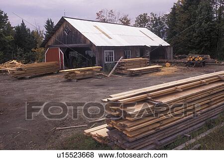 Stock Photo -  sawmill, logging, Vermont, Stacks of cut lumber outside a sawmill in Walden Station in Caledonia County in the state of Vermont. . Fotosearch