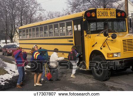 Stock Photo -  school bus, bus, Children boarding a yellow schoolbus in Exton, Pennsylvania. Fotosearch