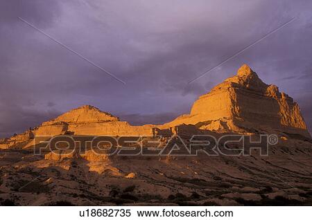 Stock Photography -  Scotts Bluff, Nebraska, Golden sunlight shines on wind-sculpted bluffs at [sunrise, sunset] in Scotts Bluff National Monument. . Fotosearch