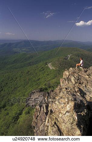Shenandoah National Park, overlook, hiking, summit, Appalachian Trail, Blue Ridge, Appalachian Mountains, Skyline Drive, Virginia, Woman sits on a rocky overlook along the Appalachian Trail (a National Scenic Trail) in the Shenandoah Nat'l Park in the st View Large Photo Image Stock Photo - Shenandoah National Park, overlook, hiking, summit, Appalachian Trail, Blue Ridge, Appalachian Mountains, Skyline Drive, Virginia, Woman sits on a rocky overlook along the Appalachian Trail (a National Scenic Trail) in the Shenandoah Nat'l Park in the st. Fotosearch