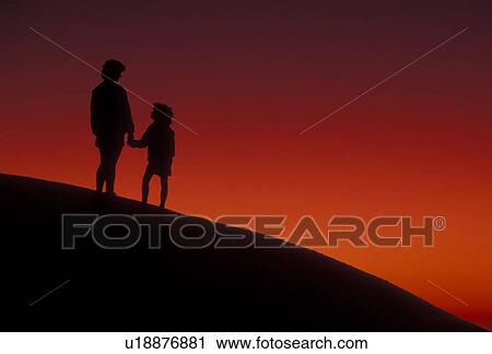 Silhouette, overlook, people, Stone Mountain, Georgia's Stone Mountain Park, Atlanta, Georgia, Silhouette of mother and young daughter holding hands and watching/looking at sunset on the summit of Stone Mountain in Georgia's Stone Mt. Park near Atlanta i View Large Photo Image Stock Image - Silhouette, overlook, people, Stone Mountain, Georgia's Stone Mountain Park, Atlanta, Georgia, Silhouette of mother and young daughter holding hands and watching/looking at sunset on the summit of Stone Mountain in Georgia's Stone Mt. Park near Atlanta i. Fotosearch