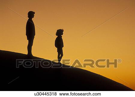 Silhouette, people, overlook, Stone Mountain, Georgia's Stone Mountain Park, Atlanta, Georgia, Silhouette of mother and young daughter watching/looking sunset on the summit of Stone Mountain in Georgia's Stone Mt. Park near Atlanta in the state of Georgi View Large Photo Image Stock Photo - Silhouette, people, overlook, Stone Mountain, Georgia's Stone Mountain Park, Atlanta, Georgia, Silhouette of mother and young daughter watching/looking sunset on the summit of Stone Mountain in Georgia's Stone Mt. Park near Atlanta in the state of Georgi. Fotosearch