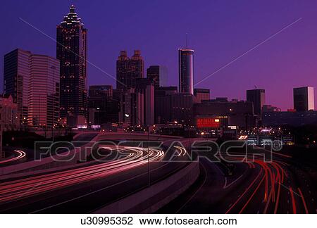 Stock Image -  skyline, Atlanta, downtown, Georgia, Skyline of downtown Atlanta at sunset from Downtown Connector Interstate I-85/I-75 in the state of Georgia.. Fotosearch