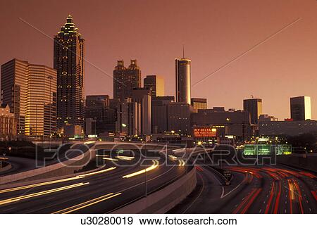 Stock Photo -  skyline, downtown, Atlanta, Georgia, Skyline of downtown Atlanta at sunset from downtown Connector Interstate I-85/I-75 in the state of Georgia.. Fotosearch