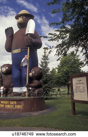 Stock Photo -  Smokey the Bear, Smokey, Minnesota, Statue of Smokey the Bear and Friends Prevent Forest Fires in Smokey Bear Park in International Falls in the state of Minnesota.. Fotosearch