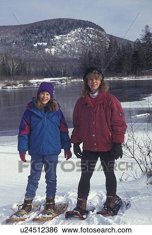 snowshoeing, Vermont, Mother and daughter (10 years old) snowshoeing together near Marshfield Pond in Marshfield in Washington County in the state of Vermont View Large Photo Image Stock Photograph - snowshoeing, Vermont, Mother and daughter (10 years old) snowshoeing together near Marshfield Pond in Marshfield in Washington County in the state of Vermont . Fotosearch
