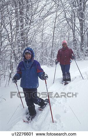 snowshoeing, Vermont, VT, Mother and daughter snowshoeing on a snowy day in winter. View Large Photo Image Stock Image - snowshoeing, Vermont, VT, Mother and daughter snowshoeing on a snowy day in winter.. Fotosearch