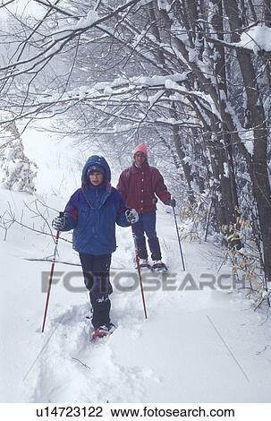 snowshoeing, Vermont, VT, Mother and daughter snowshoeing on a snowy day in winter. View Large Photo Image Stock Image -  snowshoeing, Vermont, VT, Mother and daughter snowshoeing on a snowy day in winter.. Fotosearch