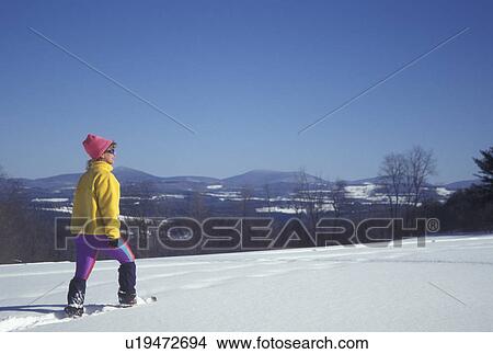 snowshoeing, Vermont, VT, Woman snowshoeing in a snow-covered field in winter in Montpelier. View Large Photo Image Picture - snowshoeing, Vermont, VT, Woman snowshoeing in a snow-covered field in winter in Montpelier.. Fotosearch