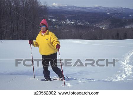 snowshoeing, Vermont, VT, Woman snowshoeing in winter in Montpelier. View Large Photo Image Stock Image - snowshoeing, Vermont, VT, Woman snowshoeing in winter in Montpelier.. Fotosearch