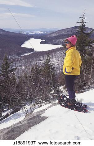 snowshoeing, Vermont, VT, Woman snowshoeing, Owl's Head, Kettle Pond, Groton State Forest, winter. View Large Photo Image Stock Photo - snowshoeing, Vermont, VT, Woman snowshoeing, Owl's Head, Kettle Pond, Groton State Forest, winter.. Fotosearch