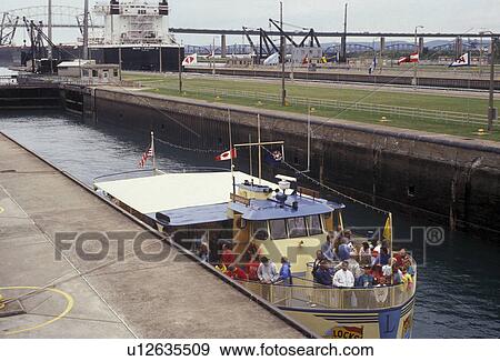 Soo Locks, lock, Upper Peninsula, U. P Michigan, Sault Ste. Marie, Tourboat in Soo Locks in Sault Sainte Marie in the state of Michigan. View Large Photo Image Stock Photo - Soo Locks, lock, Upper Peninsula, U. P Michigan, Sault Ste. Marie, Tourboat in Soo Locks in Sault Sainte Marie in the state of Michigan.. Fotosearch