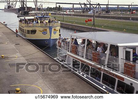 Soo Locks, lock, Upper Peninsula, U. P Michigan, Sault Ste. Marie, Lake Superior, Tourboats in Soo Locks in Sault Sainte Marie in the state of Michigan. View Large Photo Image Stock Photo - Soo Locks, lock, Upper Peninsula, U. P Michigan, Sault Ste. Marie, Lake Superior, Tourboats in Soo Locks in Sault Sainte Marie in the state of Michigan.. Fotosearch