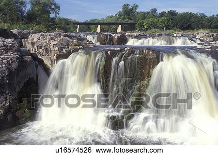 Stock Photograph -  South Dakota, Sioux Falls, waterfall at Falls Park, Big Sioux River. Fotosearch