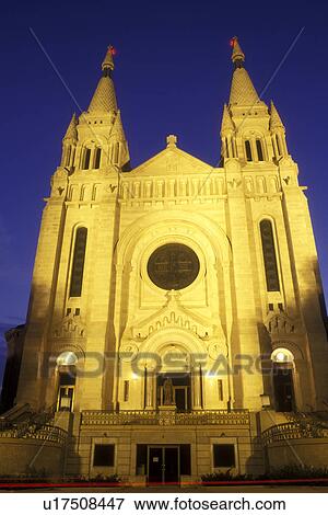 Stock Photo -  South Dakota, The facade of Saint Joseph's Cathedral is illuminated at night in Sioux Falls. French and German Romanesque Architecture.. Fotosearch
