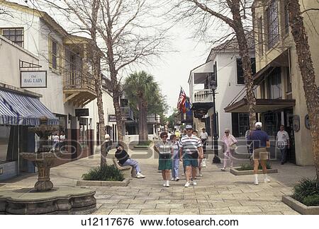 Stock Photograph -  St. Augustine, Florida, Tourist walk along St. George Street a walking mall in the old city of Saint Augustine in the state of Florida. St. Augustine is the oldest settlement in the United States . Fotosearch