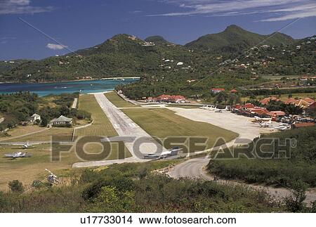 Picture -  St. Barthelemy, Caribbean, St. Barts, airport, Saint Barts, Caribbean Islands, Scenic view of the St. Jean Airport on the island of Saint Barthelemy (a department of Guadeloupe).. Fotosearch