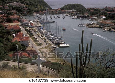 St. Barthelemy, Caribbean, St. Barts, Gustavia, Saint Barts, Caribbean Islands, Picturesque view of the marina in the harbor of Gustavia the capital of the island of Saint Barthelemy (a department of Guadeloupe). View Large Photo Image Stock Photo - St. Barthelemy, Caribbean, St. Barts, Gustavia, Saint Barts, Caribbean Islands, Picturesque view of the marina in the harbor of Gustavia the capital of the island of Saint Barthelemy (a department of Guadeloupe).. Fotosearch