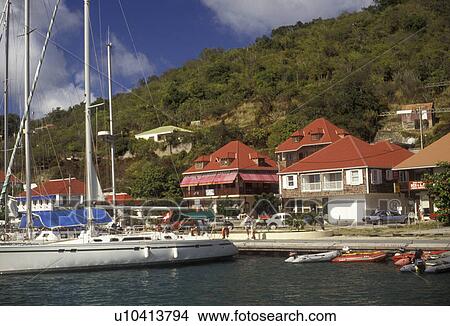 St. Barts, Caribbean, St. Barthelemy, Gustavia, Saint Barts, Caribbean Islands, Sailboat moored at a dock in the harbor of Gustavia the capital of the island of Saint Barthelemy (a department of Guadeloupe). View Large Photo Image Picture - St. Barts, Caribbean, St. Barthelemy, Gustavia, Saint Barts, Caribbean Islands, Sailboat moored at a dock in the harbor of Gustavia the capital of the island of Saint Barthelemy (a department of Guadeloupe).. Fotosearch