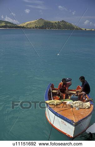 St. Martin, Caribbean, Caribbean Islands, Fishermen in boat in Grand Case Bay on the island of Saint Martin (french part). View Large Photo Image Stock Image - St. Martin, Caribbean, Caribbean Islands, Fishermen in boat in Grand Case Bay on the island of Saint Martin (french part).. Fotosearch