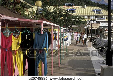 St. Martin, Caribbean, Marigot, Caribbean Islands, Colorful clothes hanging at a boutique along a marina in Marigot the French capital of the island of Saint Martin (french part). View Large Photo Image Stock Photography - St. Martin, Caribbean, Marigot, Caribbean Islands, Colorful clothes hanging at a boutique along a marina in Marigot the French capital of the island of Saint Martin (french part).. Fotosearch
