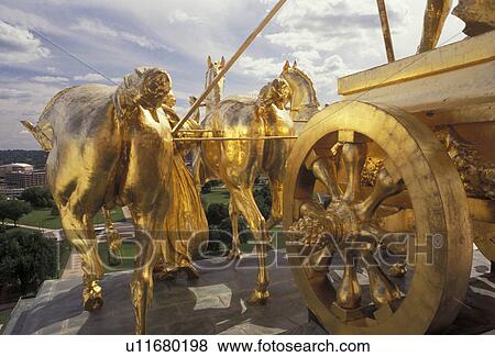 State Capitol, State House, St. Paul, Twin cities, Minnesota, The Progress of the State a gilded four-horse chariot statue adorns the base of the capitol dome in the capital city of Saint Paul in the state of Minnesota. View Large Photo Image Stock Photo - State Capitol, State House, St. Paul, Twin cities, Minnesota, The Progress of the State a gilded four-horse chariot statue adorns the base of the capitol dome in the capital city of Saint Paul in the state of Minnesota.. Fotosearch