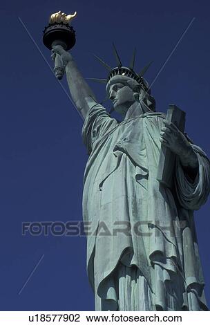 Stock Image -  Statue of Liberty, New York City, close-up, Statue of Liberty National Monument, N. Y. C New York, NYC, Statue of Liberty Nat'l Monument towers over Liberty Island against a clear blue sky in New York City in the state of New York. . Fotosearch