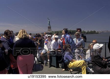 Statue of Liberty, tourboat, New York City, Manhattan, N. Y. C New York, NYC, Tourists aboard the Statue of Liberty Ferry on a sunny day leaving Battery Park in Lower Manhattan in New York City in the state of New York. Statue of Liberty can be seen in the View Large Photo Image Stock Photography - Statue of Liberty, tourboat, New York City, Manhattan, N. Y. C New York, NYC, Tourists aboard the Statue of Liberty Ferry on a sunny day leaving Battery Park in Lower Manhattan in New York City in the state of New York. Statue of Liberty can be seen in the. Fotosearch
