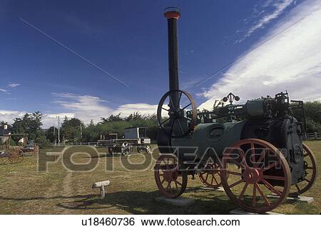 Stock Photograph -  steam tractor, Patagonia, Chile, Antique farm machinery is displayed at the Patagonian Institute in the town of Punta Arenas in Chile.. Fotosearch