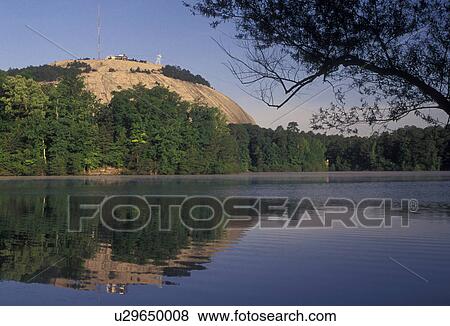Stone Mountain, Stone Mountain Park, Atlanta, Georgia, Scenic view of Stone Mountain (largest granite rock in the world) a massive dome of granite rising 825 feet above the plain across the lake in Georgia's Stone Mountain Park near Atlanta in the state View Large Photo Image Stock Photo - Stone Mountain, Stone Mountain Park, Atlanta, Georgia, Scenic view of Stone Mountain (largest granite rock in the world) a massive dome of granite rising 825 feet above the plain across the lake in Georgia's Stone Mountain Park near Atlanta in the state . Fotosearch