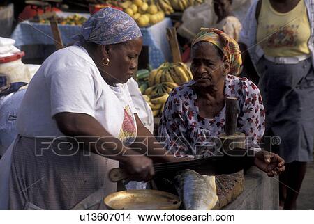 street market, Guadeloupe, Caribbean, Caribbean Islands, Local black woman cutting fish for sale at open air market on Market Day in Pointe-a-Pitre on the island of Grand Terre in Guadeloupe (a french department) The Emerald Isle. View Large Photo Image Picture - street market, Guadeloupe, Caribbean, Caribbean Islands, Local black woman cutting fish for sale at open air market on Market Day in Pointe-a-Pitre on the island of Grand Terre in Guadeloupe (a french department) The Emerald Isle.. Fotosearch