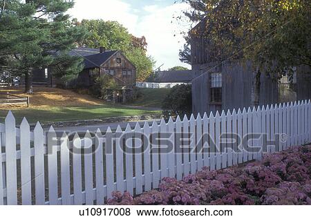 Sturbridge, Massachusetts, A white picket fence stands in front of historic buildings in the Old Sturbridge Village View Large Photo Image Stock Photo - Sturbridge, Massachusetts, A white picket fence stands in front of historic buildings in the Old Sturbridge Village . Fotosearch