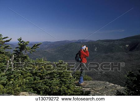 summit, overlook, mountain, Maine, Baxter State Park, Man looking through binoculars at the beautiful scenery from Double Top Mountain. View Large Photo Image Stock Image - summit, overlook, mountain, Maine, Baxter State Park, Man looking through binoculars at the beautiful scenery from Double Top Mountain.. Fotosearch