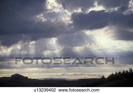 sunray, cloud, weather, Switzerland, Berne, Europe, Sunrays shine through layers of clouds in Belpberg in the Canton of Bern. View Large Photo Image Stock Image - sunray, cloud, weather, Switzerland, Berne, Europe, Sunrays shine through layers of clouds in Belpberg in the Canton of Bern.. Fotosearch