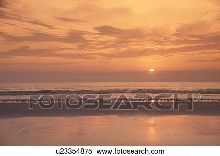 sunrise, sunset, Cumberland Island, Georgia, ocean, Scenic view of the sunrise on the calm waters of the Atlantic Ocean from Cumberland Island National Seashore, Georgia. View Large Photo Image Stock Photography - sunrise, sunset, Cumberland Island, Georgia, ocean, Scenic view of the sunrise on the calm waters of the Atlantic Ocean from Cumberland Island National Seashore, Georgia.. Fotosearch