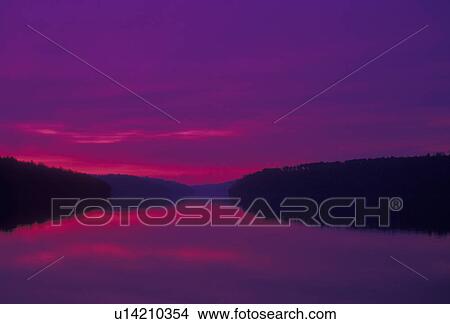 sunrise, sunset, lake, reflection, Blue Ridge Mountains, Virginia, The purple/pink sky reflects in the calm waters of Philpott Reservoir/Lake at sunrise in the state of Virginia. View Large Photo Image Picture - sunrise, sunset, lake, reflection, Blue Ridge Mountains, Virginia, The purple/pink sky reflects in the calm waters of Philpott Reservoir/Lake at sunrise in the state of Virginia.. Fotosearch