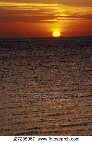 sunrise, sunset, sun, Lake Superior, Pictured Rocks, Upper Peninsula, U. P Michigan, Scenic view of the sunset on Lake Superior from Pictured Rocks National Lakeshore in Munising in the state of Michigan. View Large Photo Image Stock Photo - sunrise, sunset, sun, Lake Superior, Pictured Rocks, Upper Peninsula, U. P Michigan, Scenic view of the sunset on Lake Superior from Pictured Rocks National Lakeshore in Munising in the state of Michigan.. Fotosearch