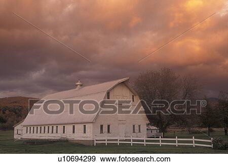 sunset, clouds, farm, barn, Vermont, Colorful clouds light up at sunset behind a white barn in Underhill in Lamoille County in the state of Vermont. View Large Photo Image Stock Photo - sunset, clouds, farm, barn, Vermont, Colorful clouds light up at sunset behind a white barn in Underhill in Lamoille County in the state of Vermont.. Fotosearch